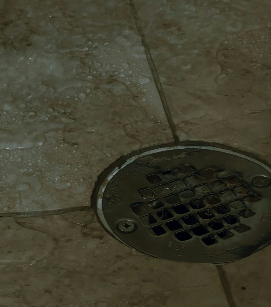 Floor drain in a tiled bathroom