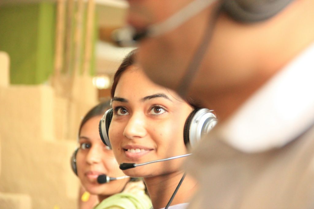 Support staff taking calls on headsets