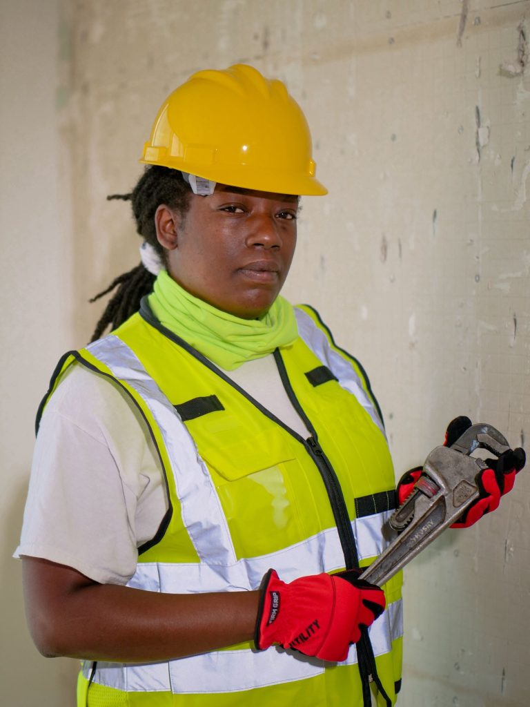 Technician in a high-visibility vest and hard hat