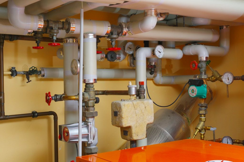Pipes and valves in a plant room